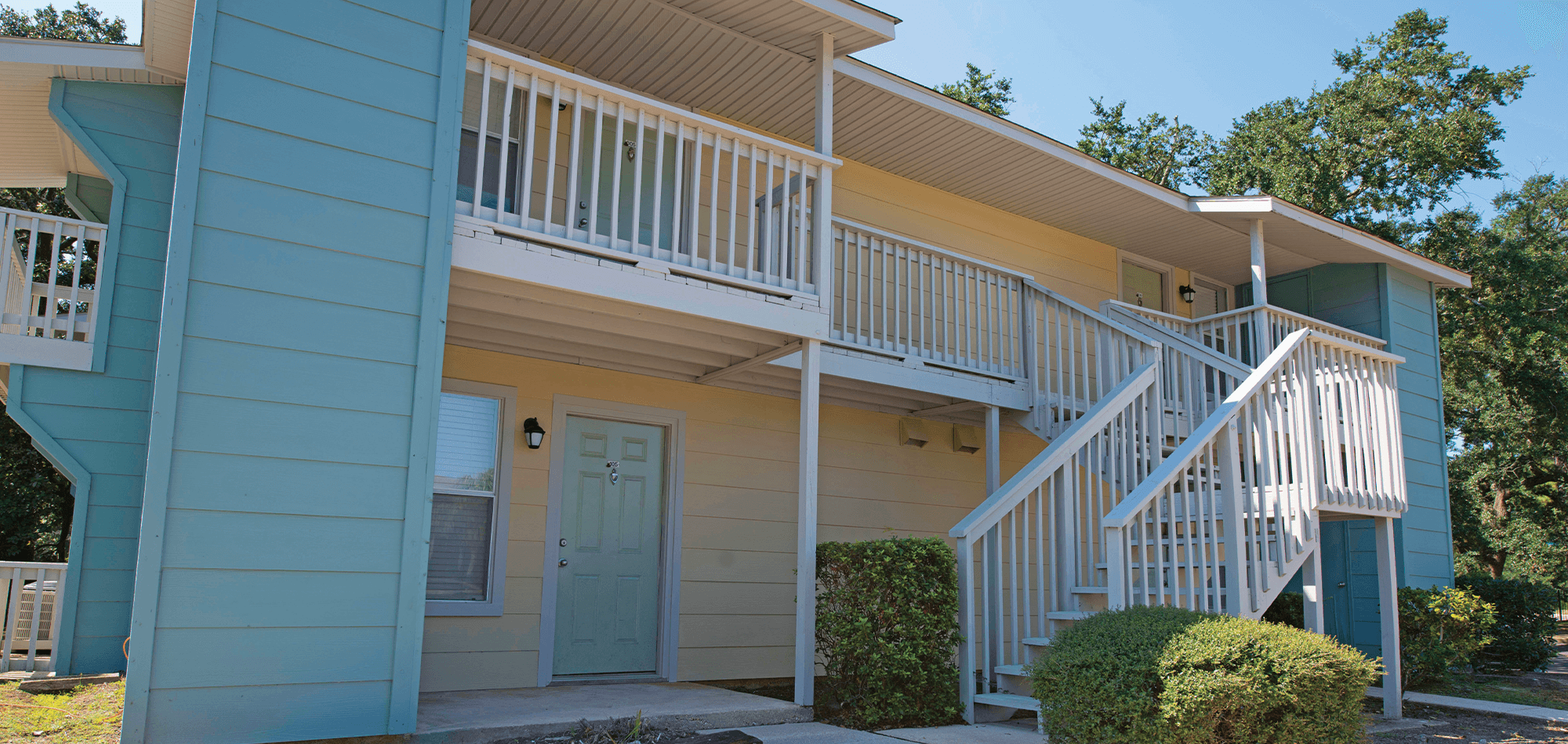 Exterior view of 701 South apartments showing the stairs leading to second floor.