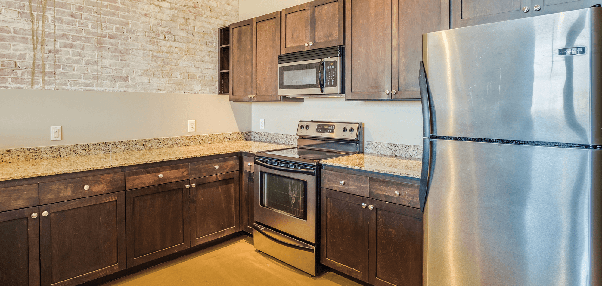 kitchen view of 22 monroe with dark wood cabinets