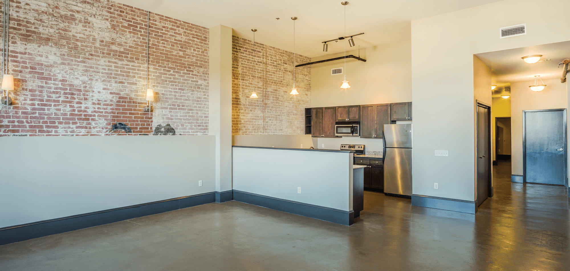 Full view of 22 Monroe Apartments with living room and attached kitchen