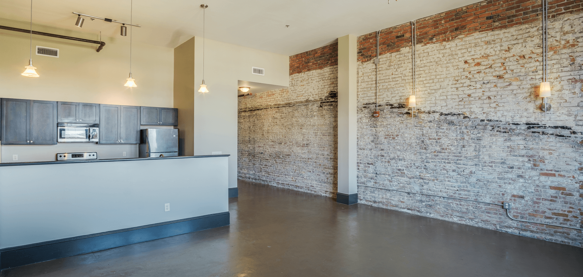 Full view of 22 Monroe Apartments with living room and attached kitchen