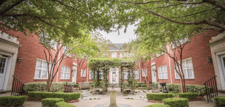 The vine covered sitting area of Adams Avenue Flats courtyard